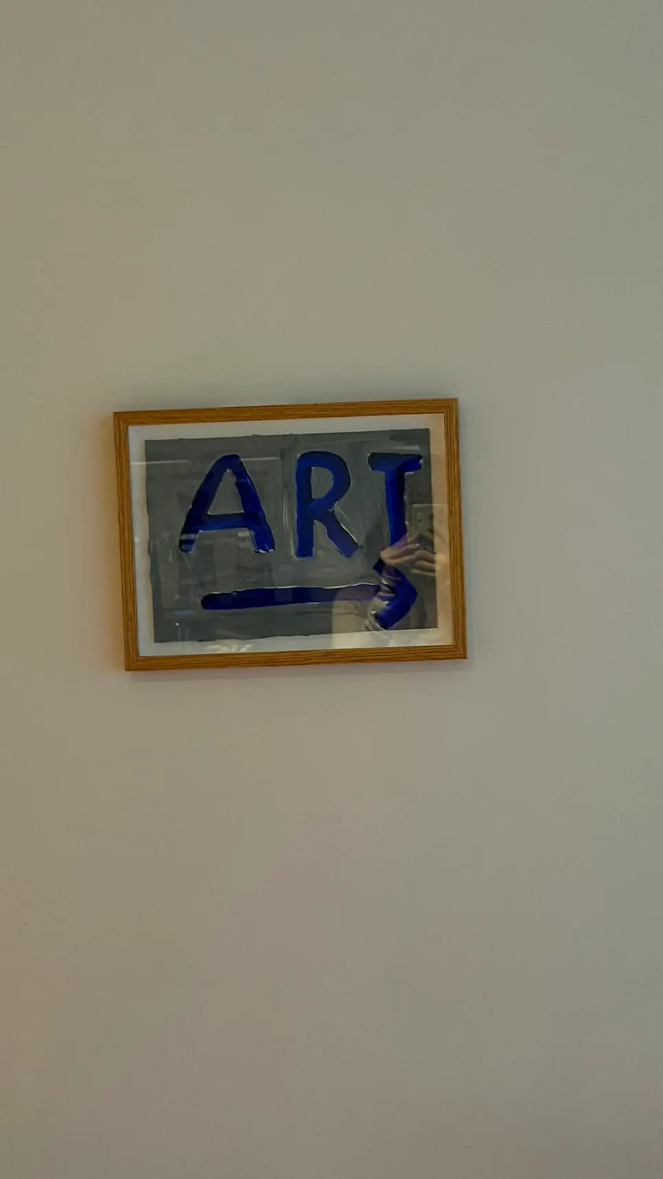 Small framed pictures and other café decor on the wall