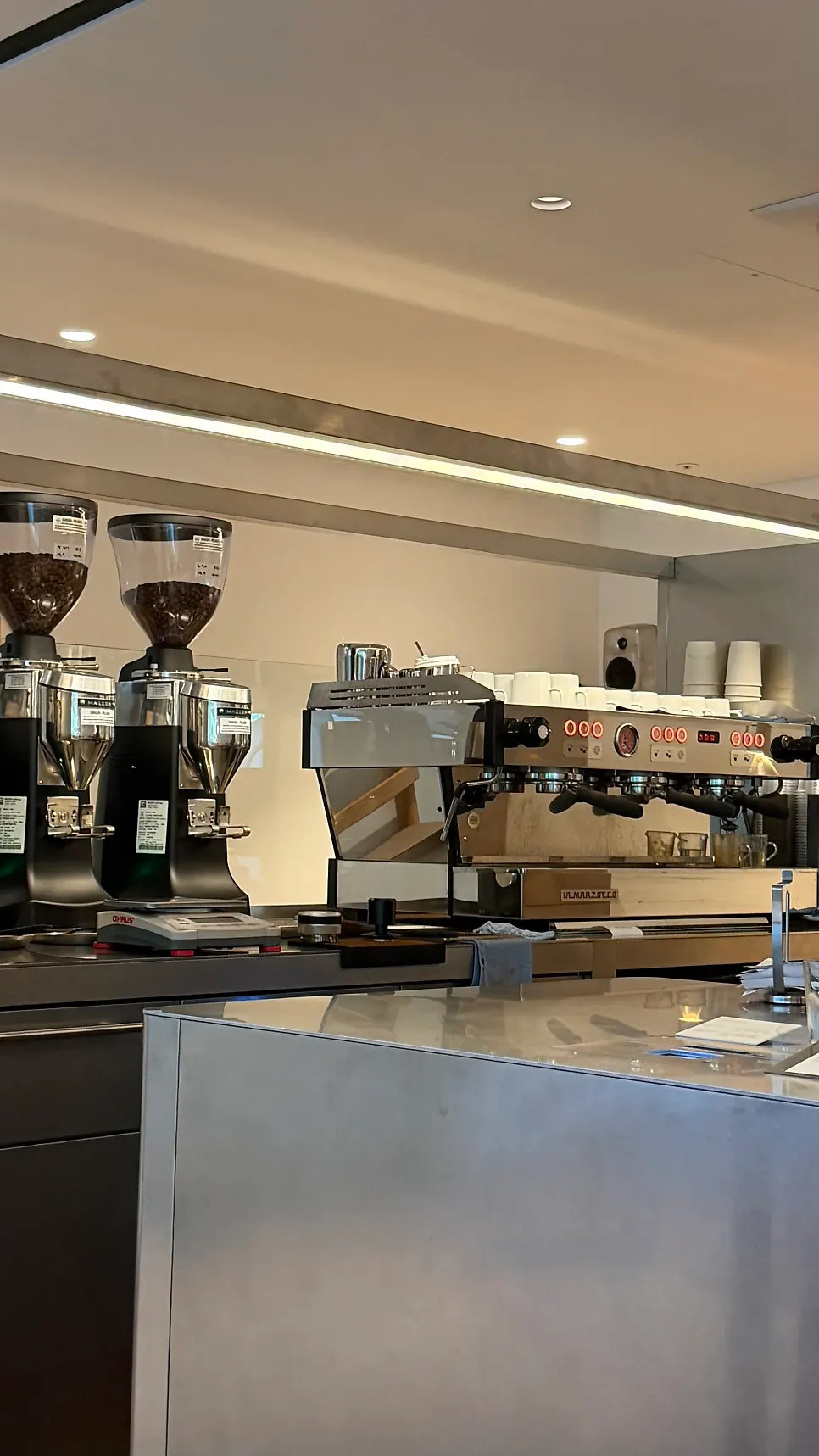 Counter with coffee machines and grinders