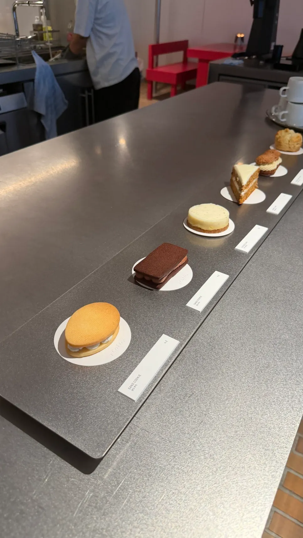 Dessert display case with cookies and cakes