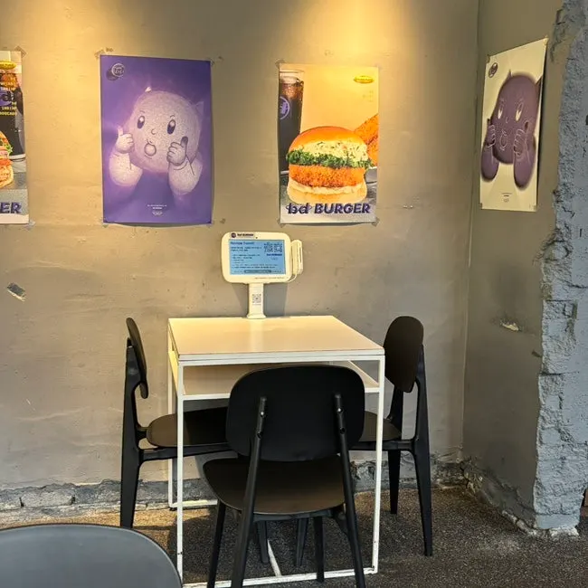Seating and tables inside bd Burger Seongsu