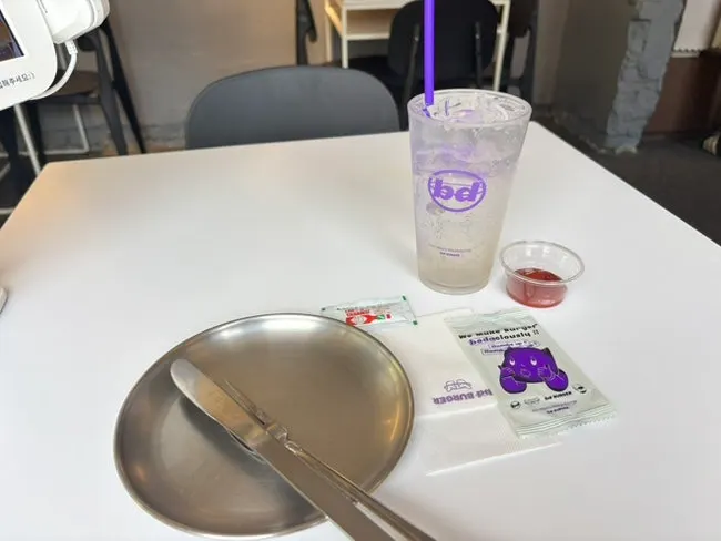 Sauces and utensils gathered from the self-serve bar