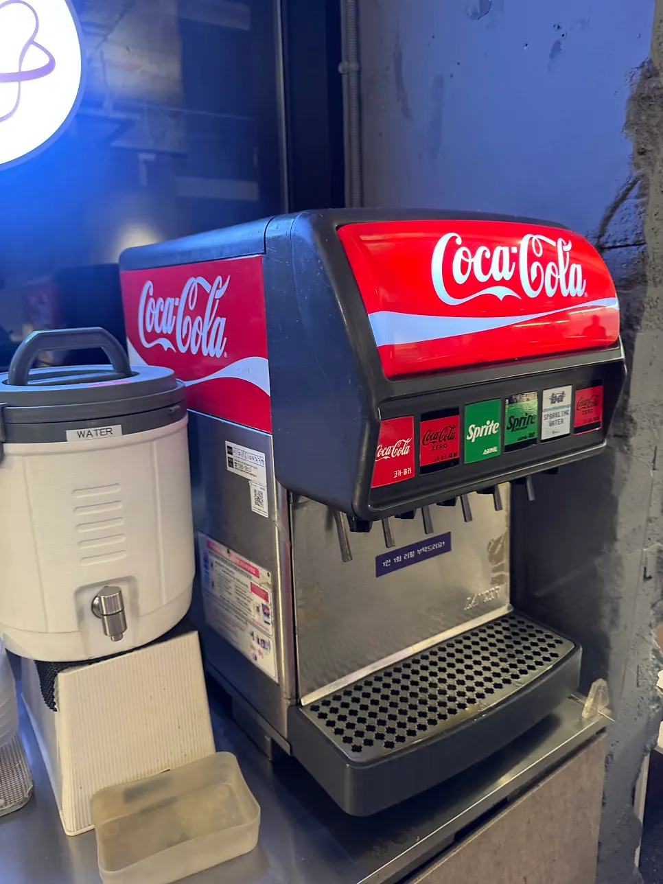 Self-serve bar with plates, forks, and ketchup