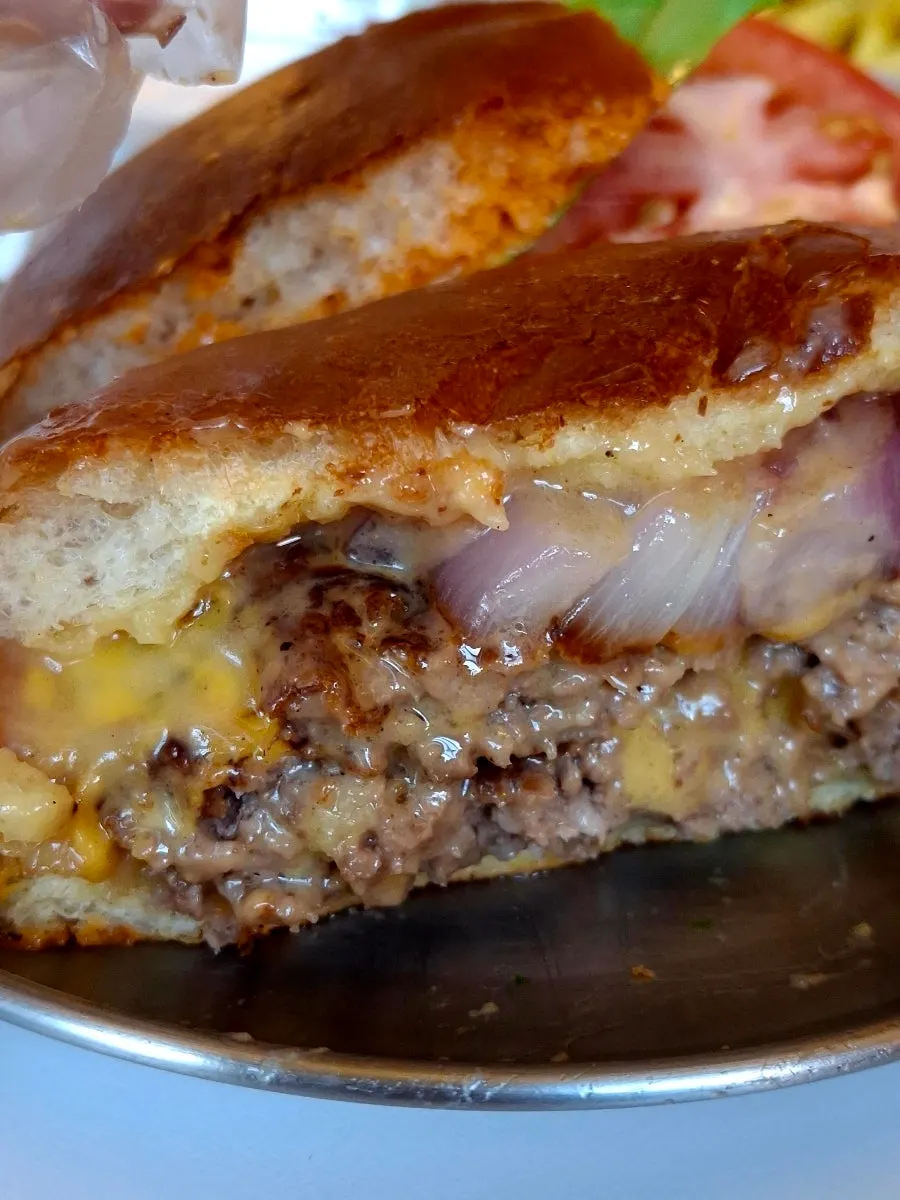 Melted cheese on the double cheese burger patty