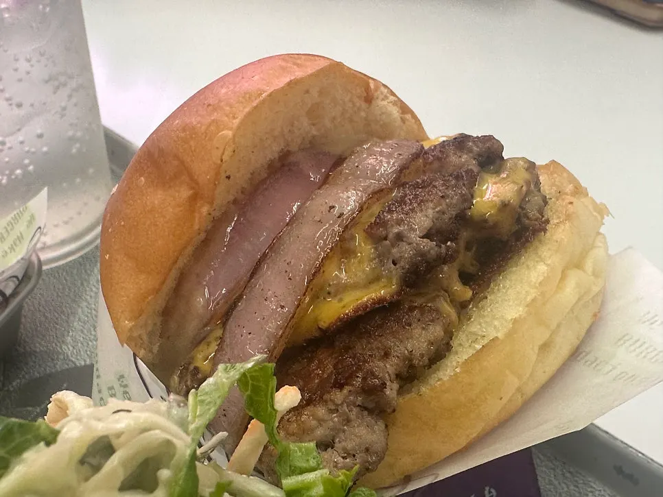 Close-up of the double cheese burger with melted cheese