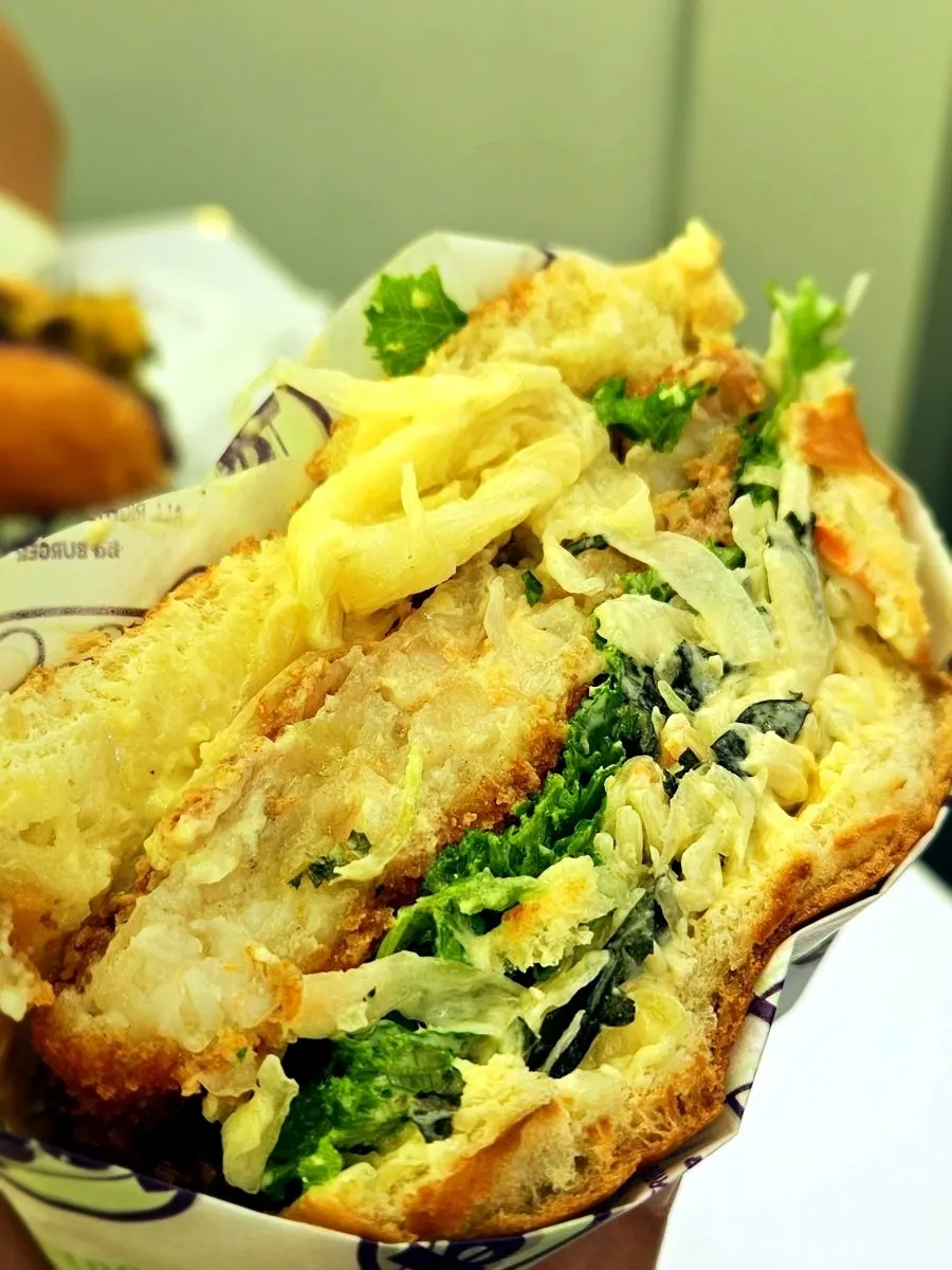 Cross-section of the shrimp burger with wasabi sauce and perilla leaf