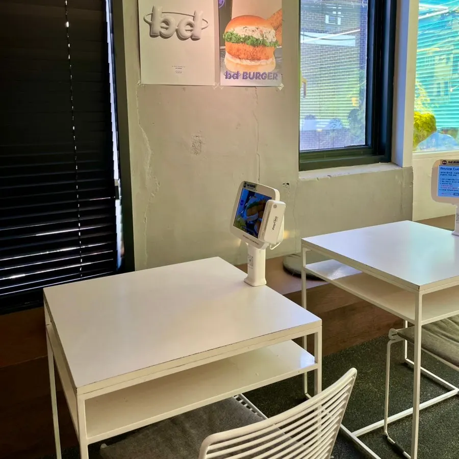 View of the tables and group seating at bd Burger Seongsu