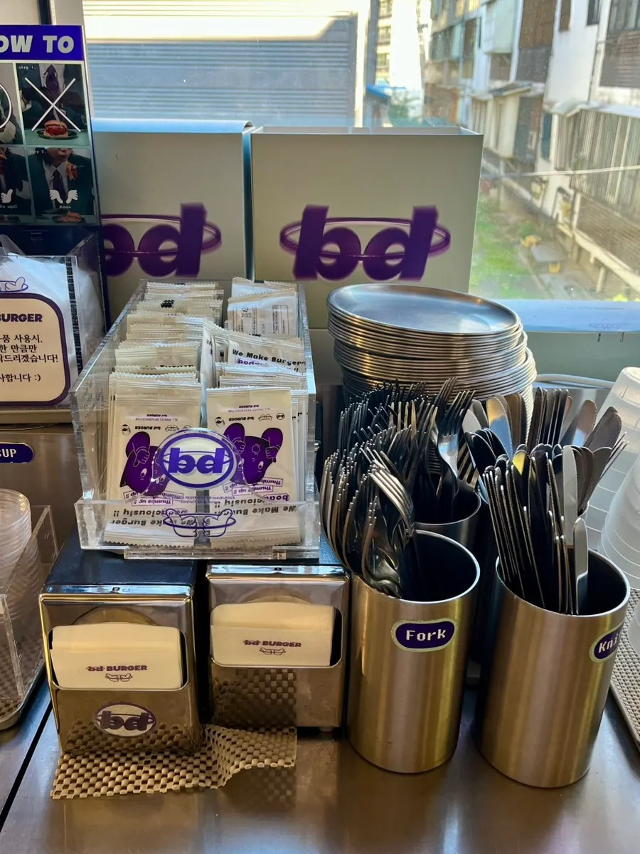 Disposables and utensils stand at the self-bar