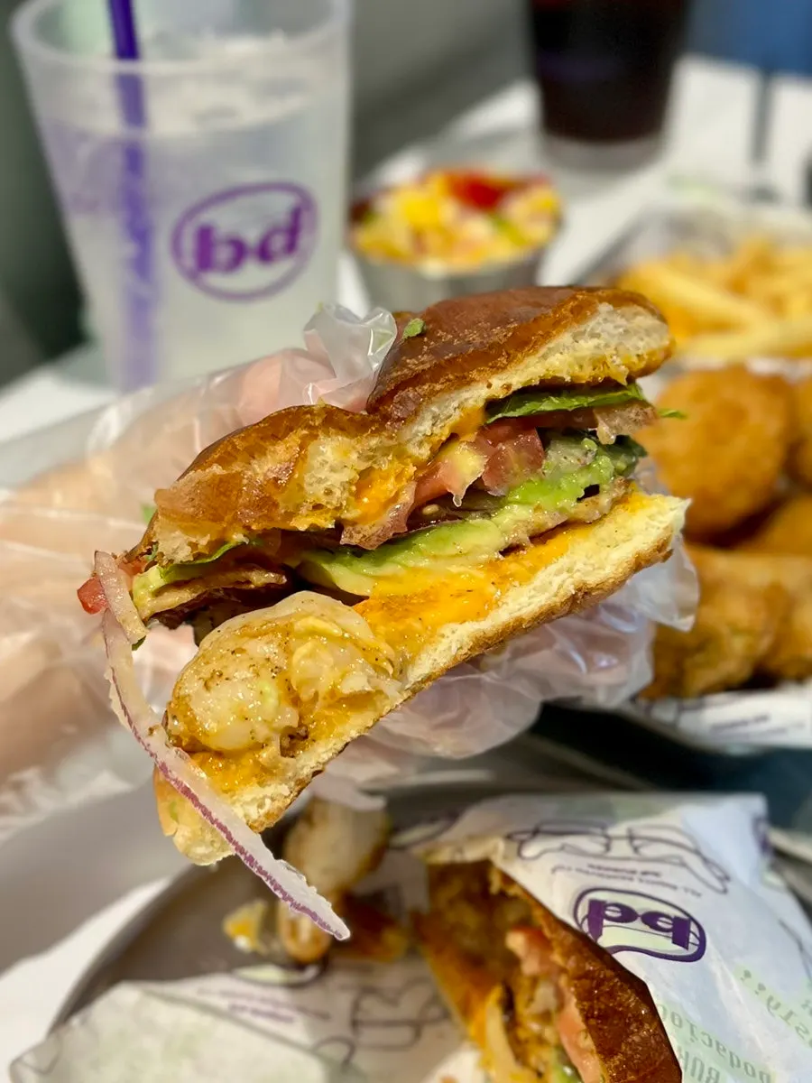 Cross-section of the shrimp burger with whole shrimp and avocado