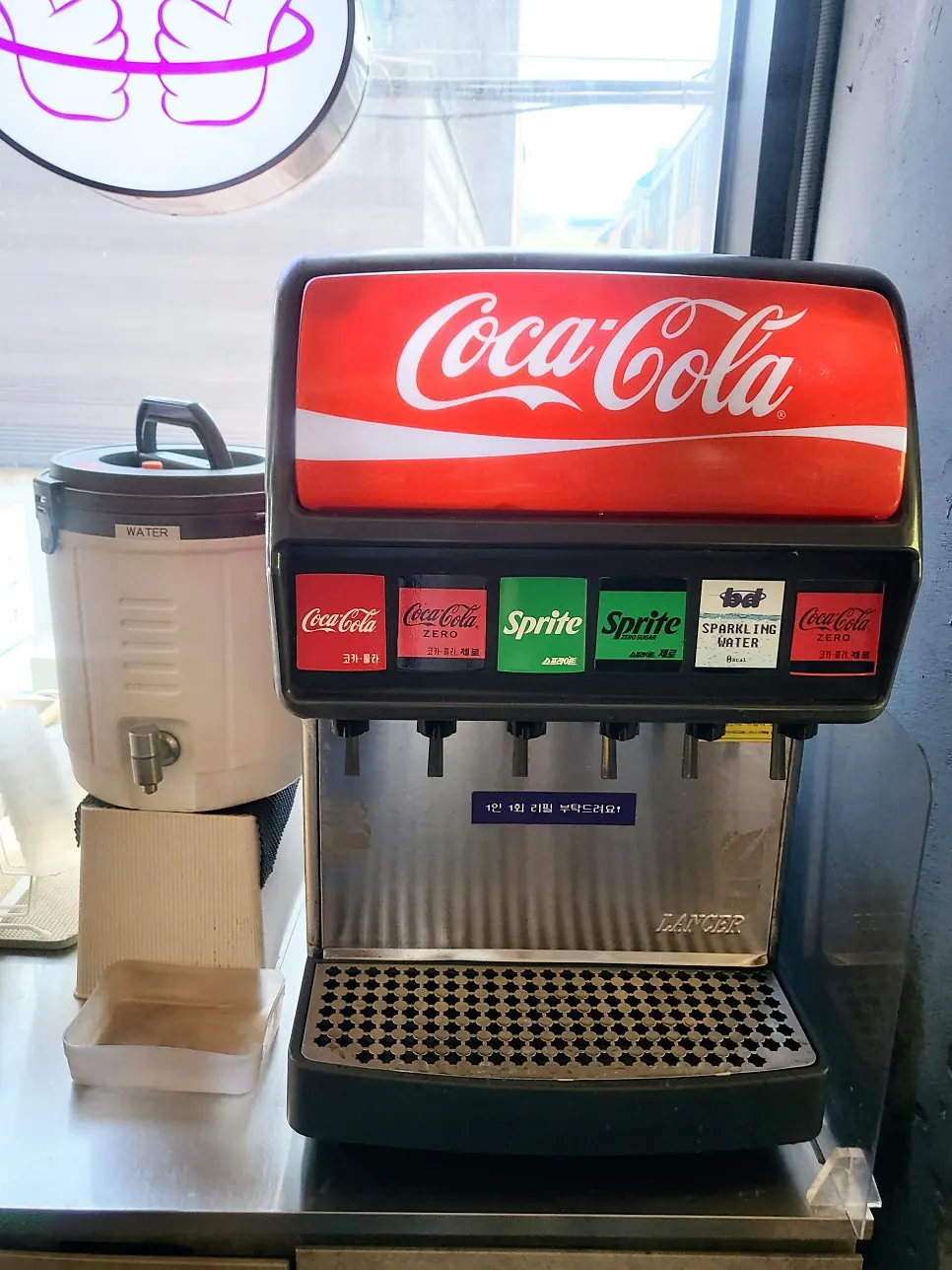 Self-service bar and dining area at bd Burger Seongsu