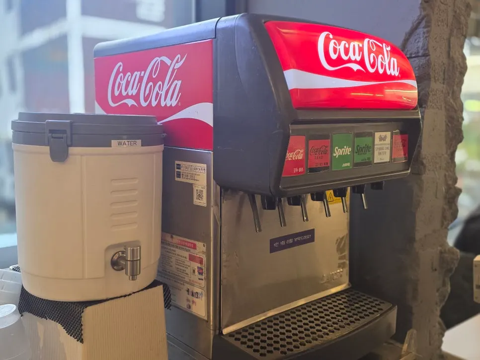 Self-serve bar with straws, ketchup, and small plates