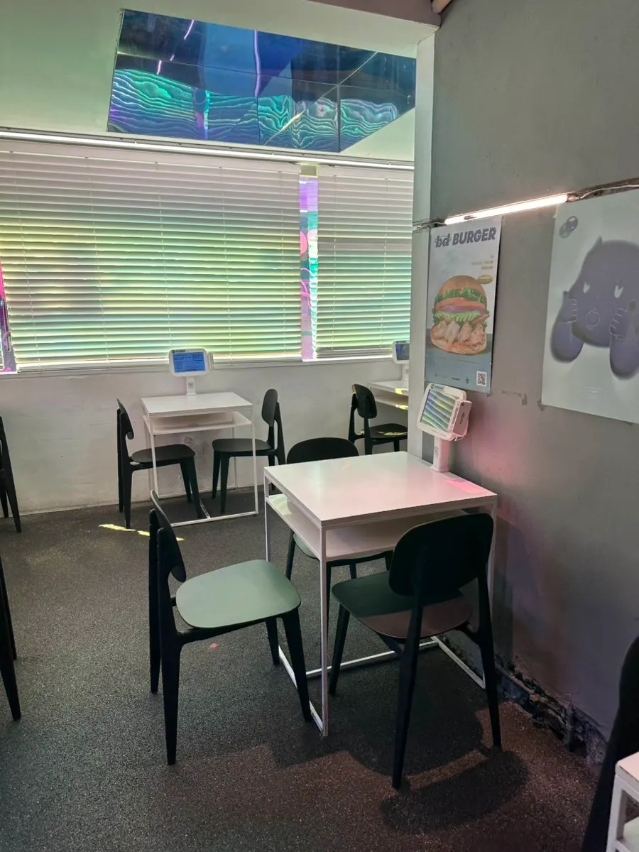 Interior of bd Burger Seongsu with 2-person tables