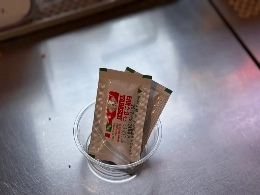 Hot sauce and ketchup grabbed from the self-bar