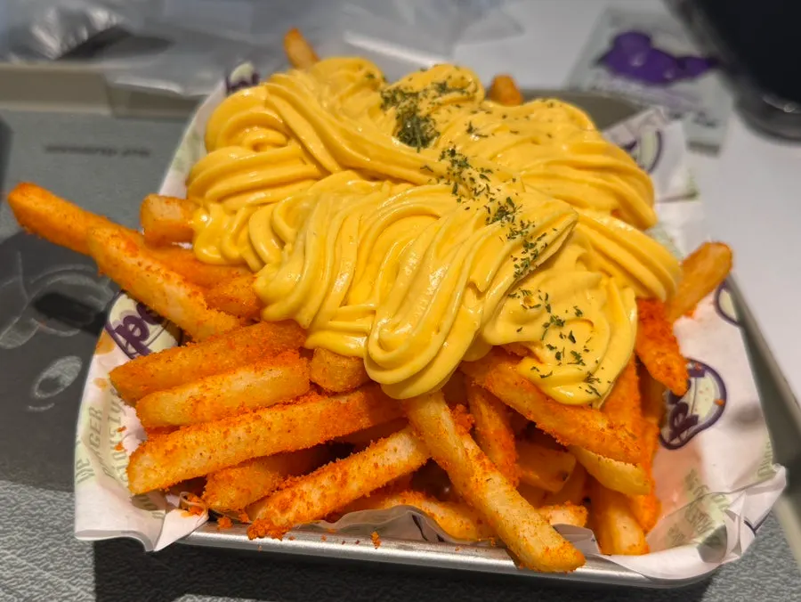 Butter Garlic Fries piled high with sauce