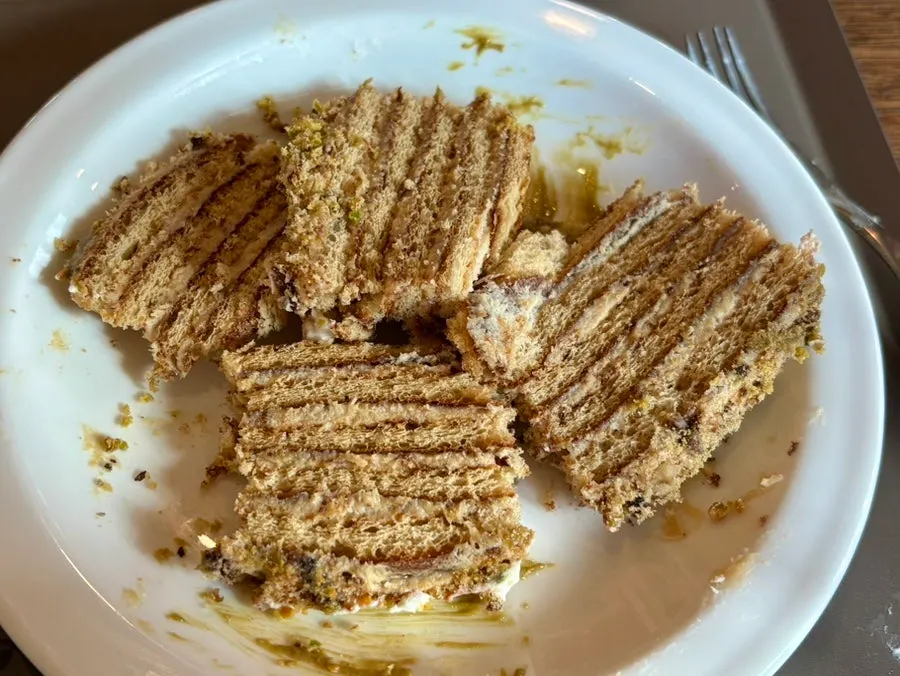 Cross-section of pistachio walnut Malenka honey cake