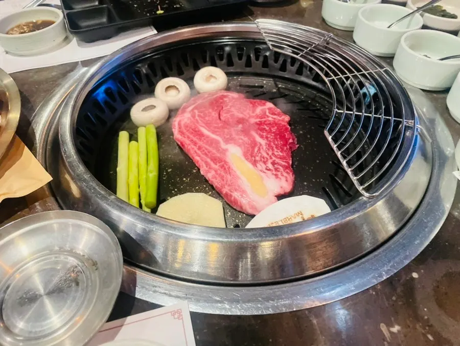 Korean beef grilled by a staff member