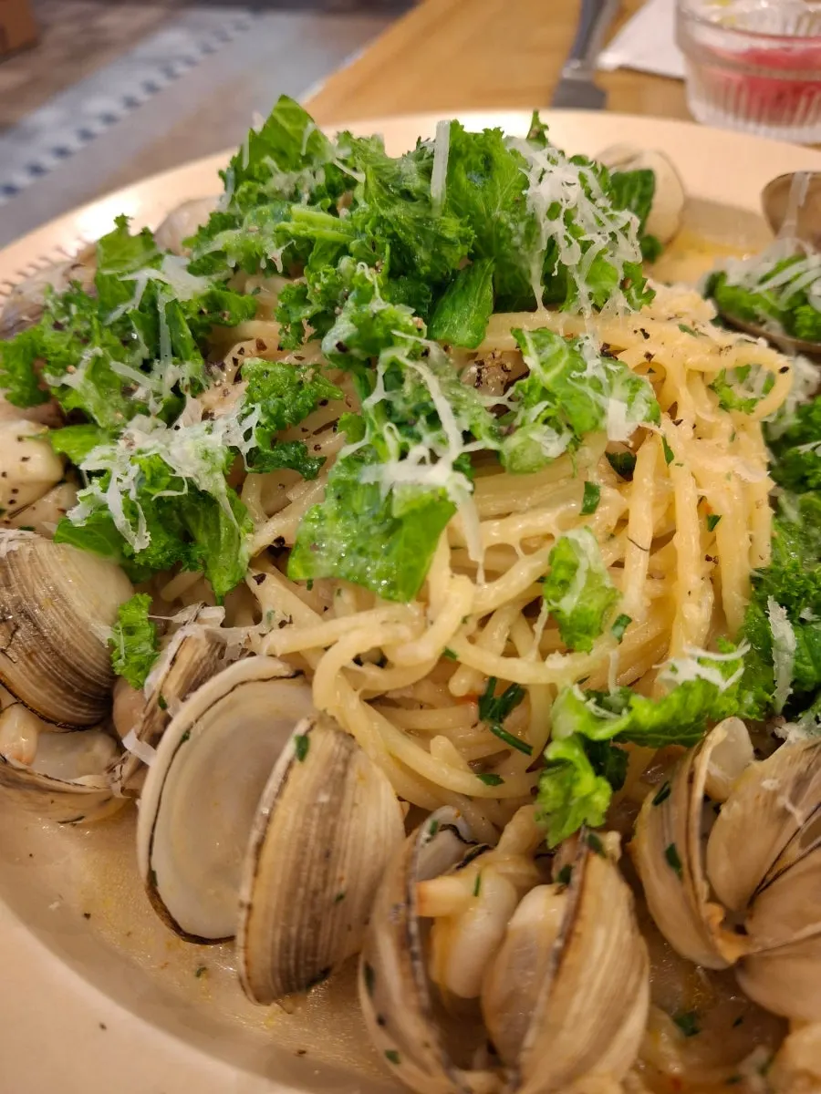 Oil pasta noodles twirled onto a fork