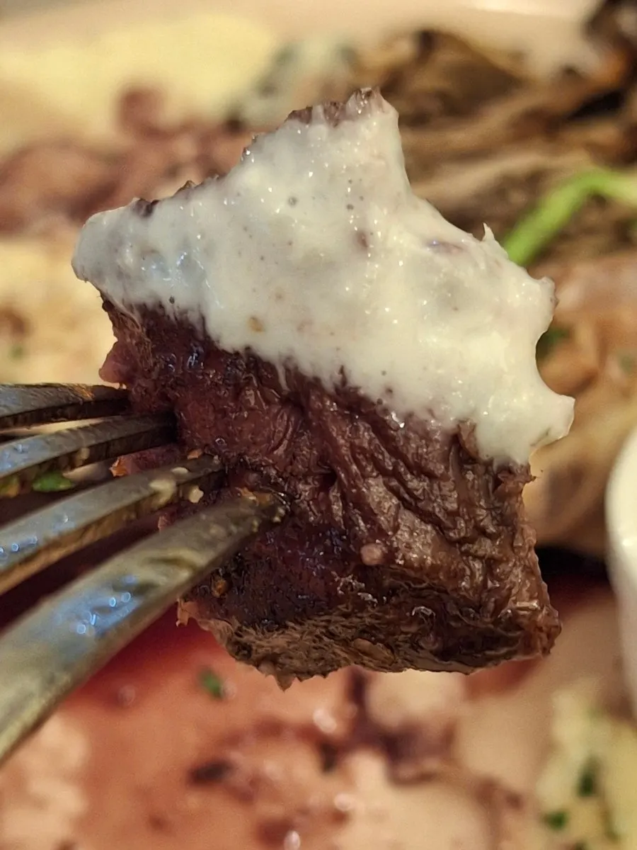 Close-up of the cheese-covered steak