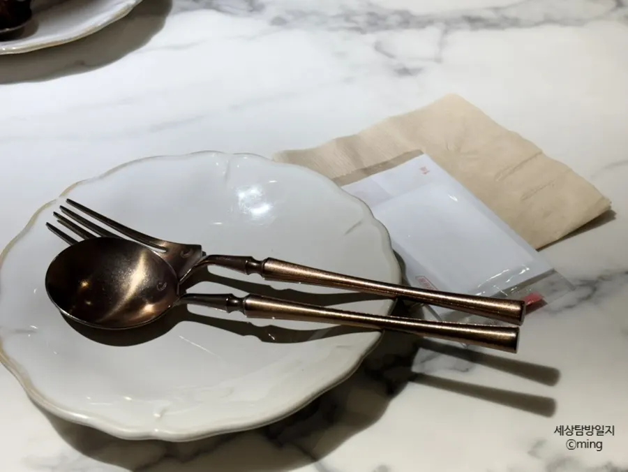 Table setting with plates, cutlery, and wet wipes