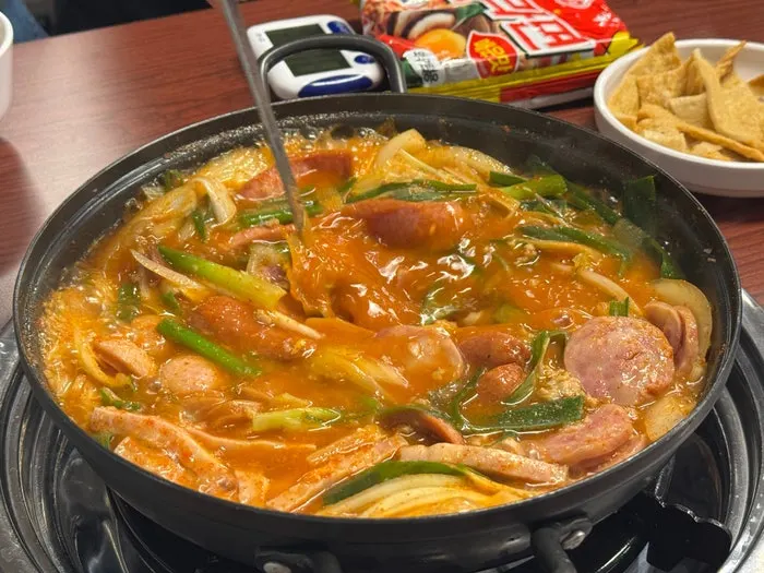 Unboiled budae jjigae loaded with sausage and ham