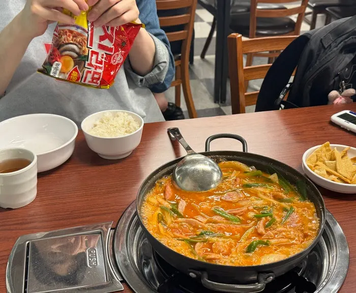 Pot of budae jjigae bubbling away