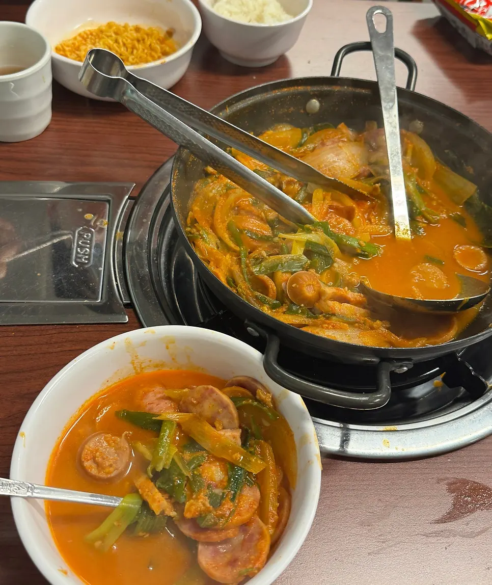 Budae jjigae mixed together with millet rice
