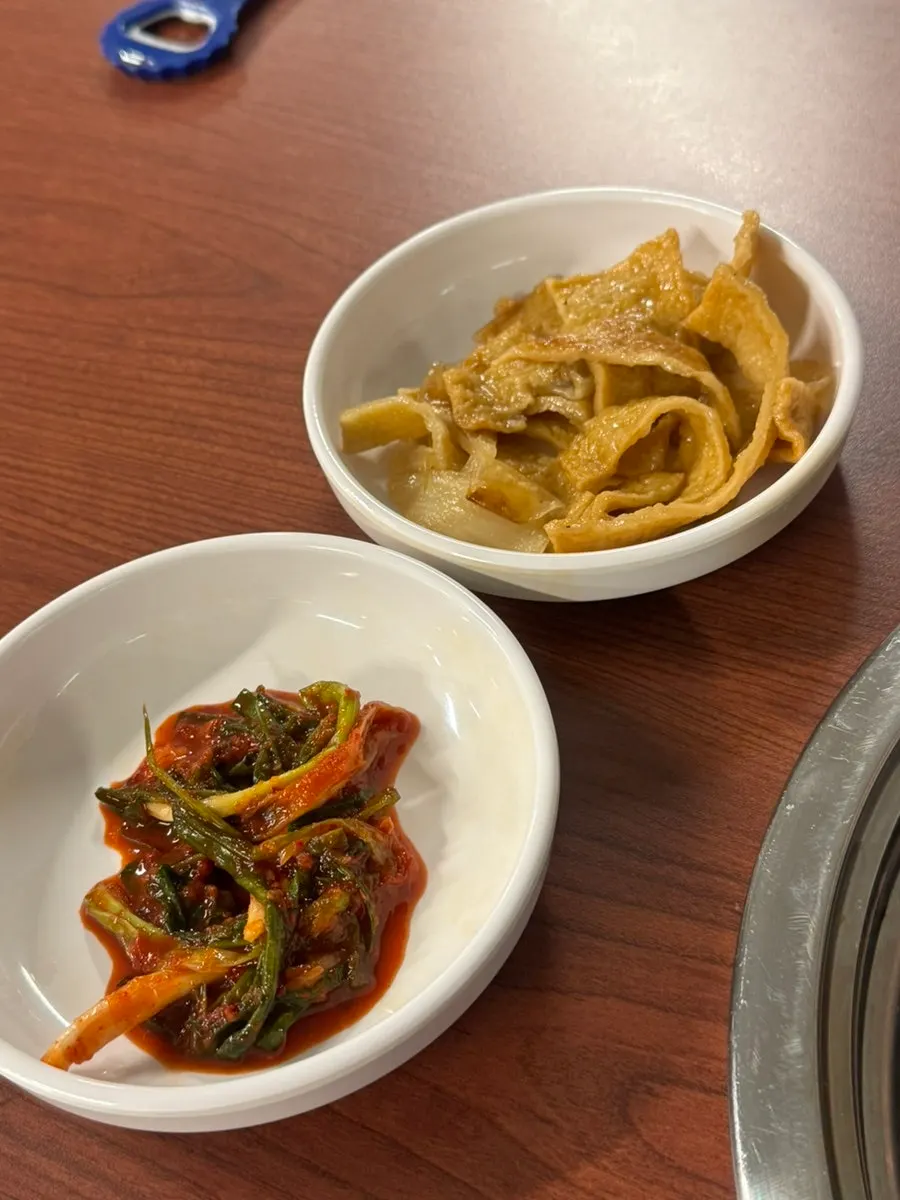Basic side dishes: pa-kimchi, stir-fried fish cake, and pickled onions