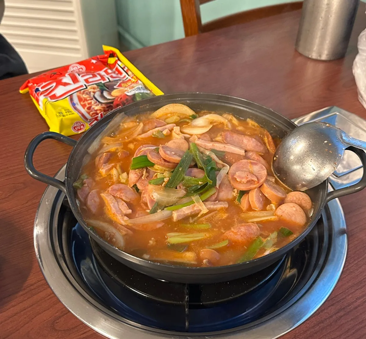 A full table spread of budae jjigae at Songtan Jindaegwang Budae Jjigae Seongsu Branch