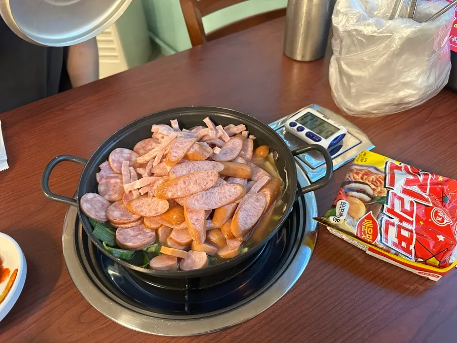 A whole block of Jin Ramen placed on top of the budae jjigae