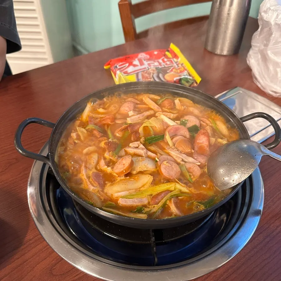 A close-up of the budae jjigae bubbling away
