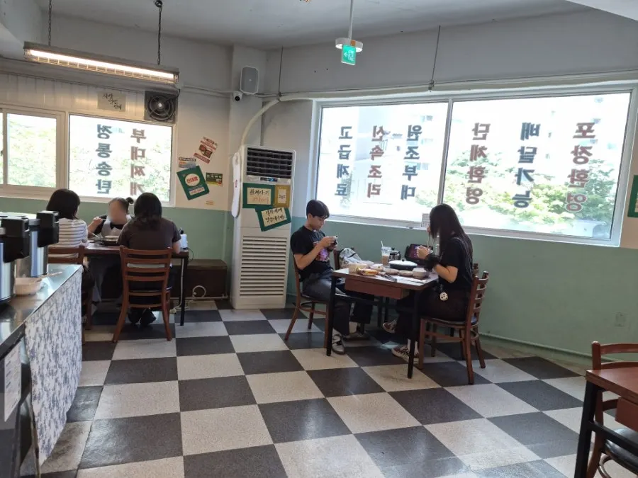 Spacious dining hall with generously spaced tables