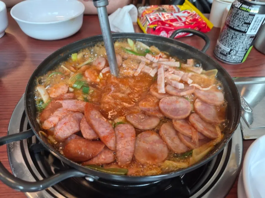 Budae jjigae bubbling away as it cooks