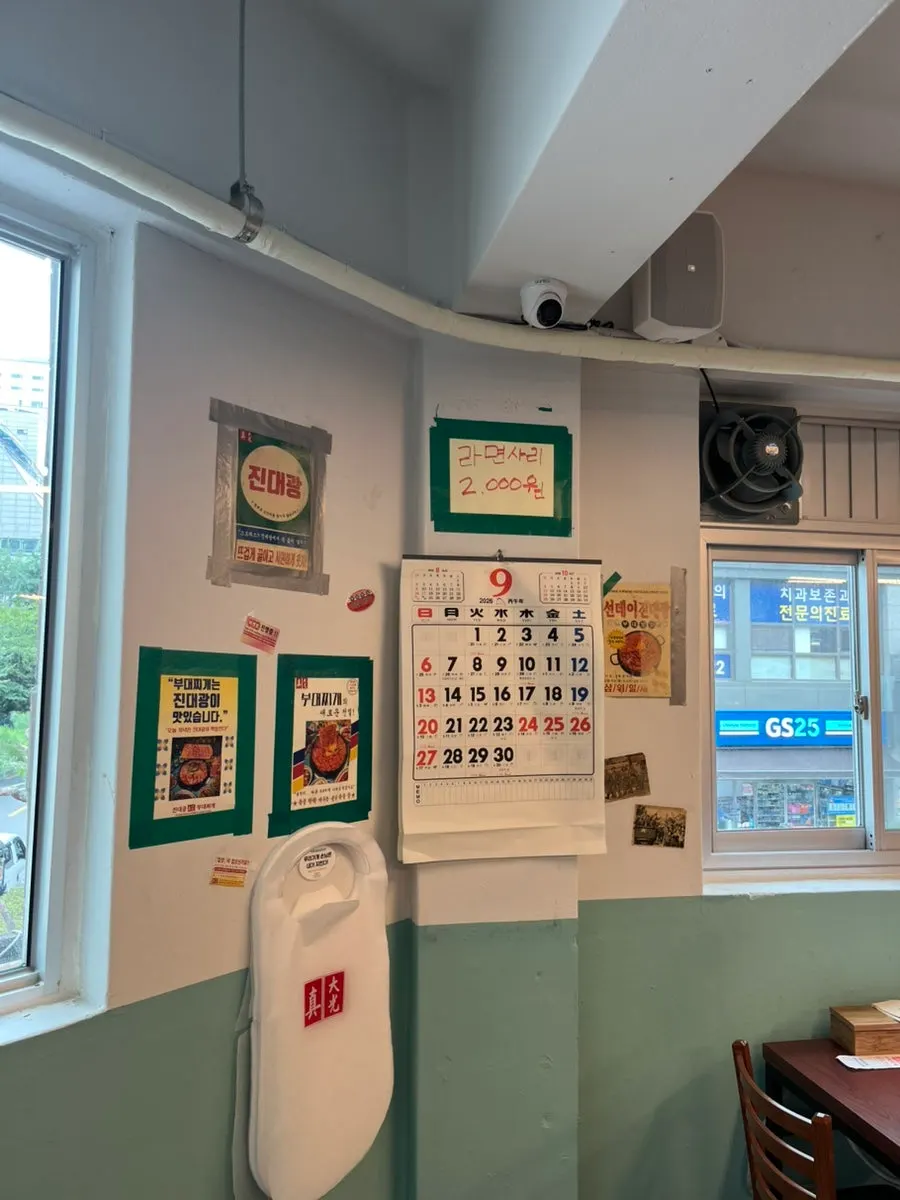 Restaurant wall covered in posters with a retro atmosphere