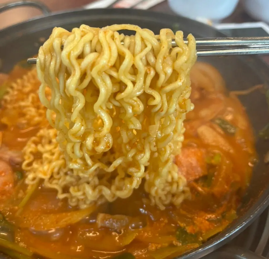 Springy Jin Ramen noodles cooked in the budae jjigae broth