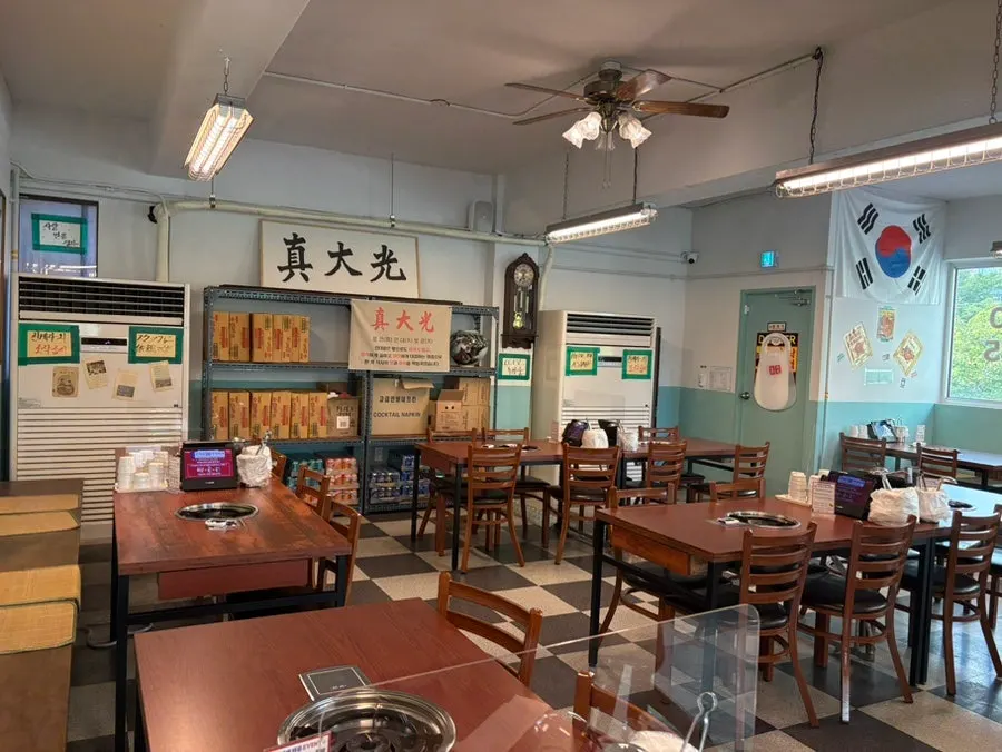 Restaurant entrance with budae jjigae posters