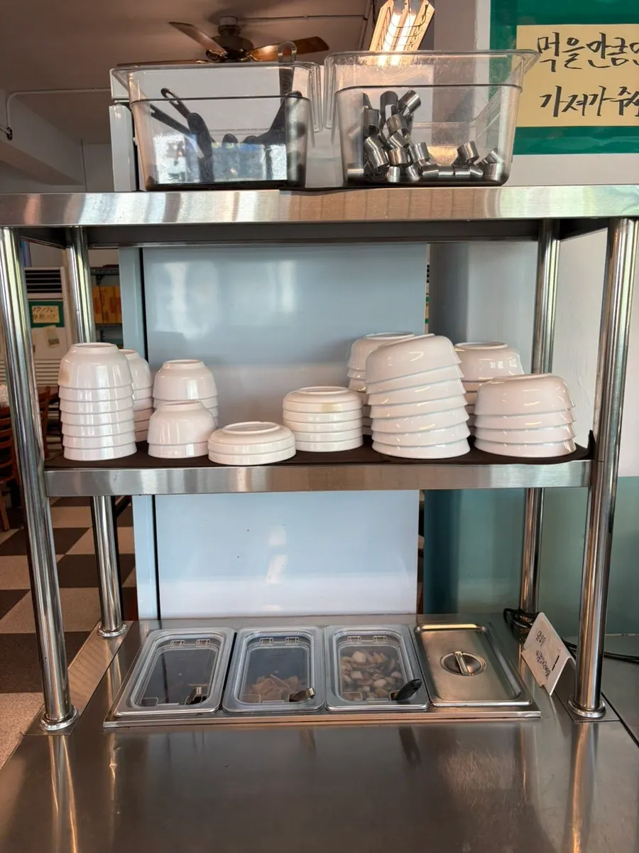 Self-service corner with side dishes and tableware