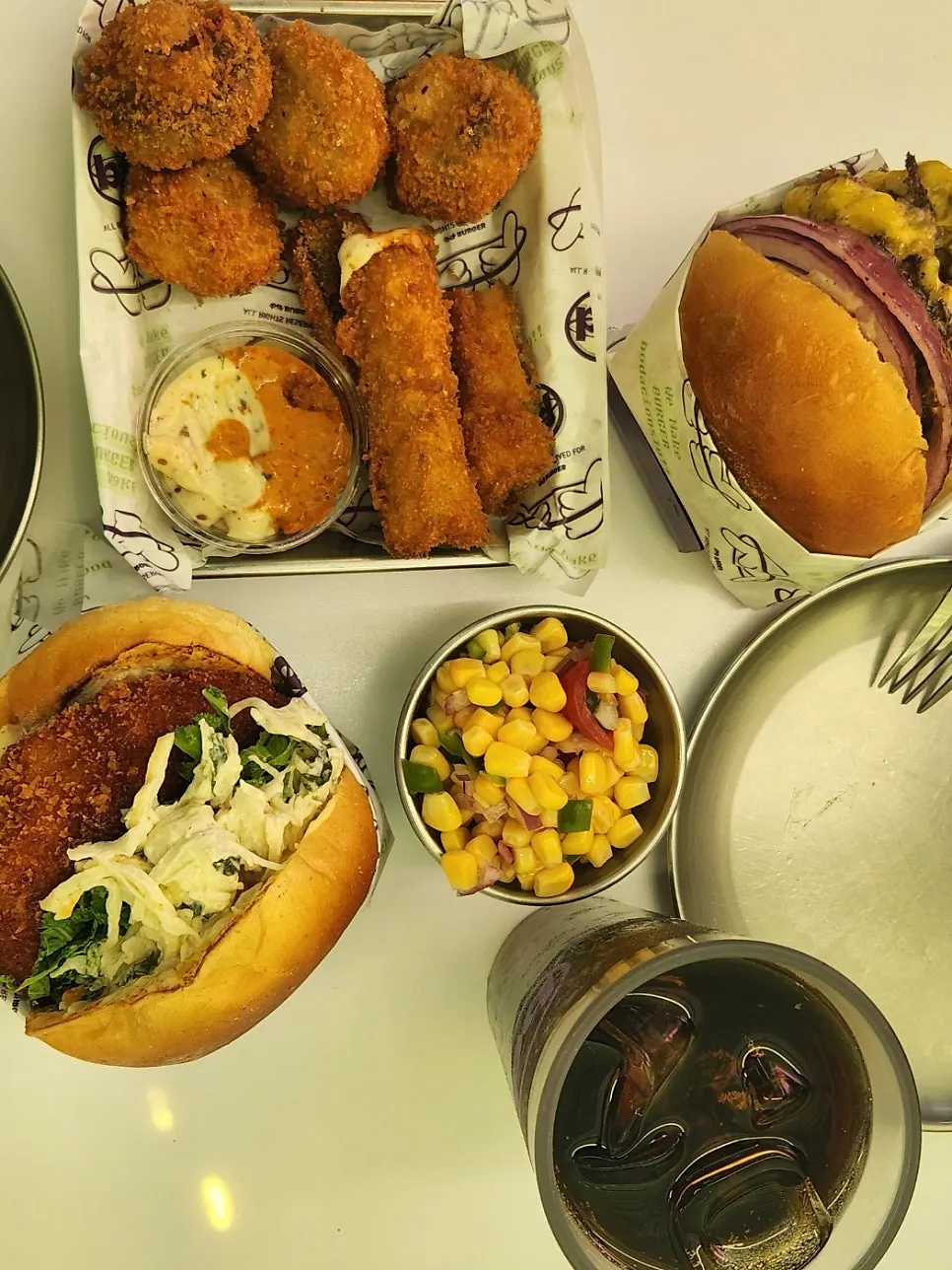 Burger, fritters, and corn salad order