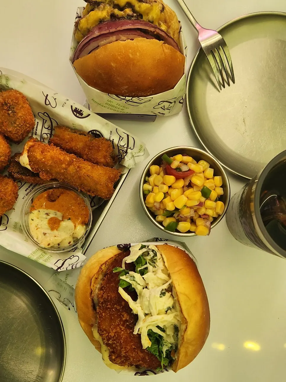 Whole shrimp burger and crisp side dishes