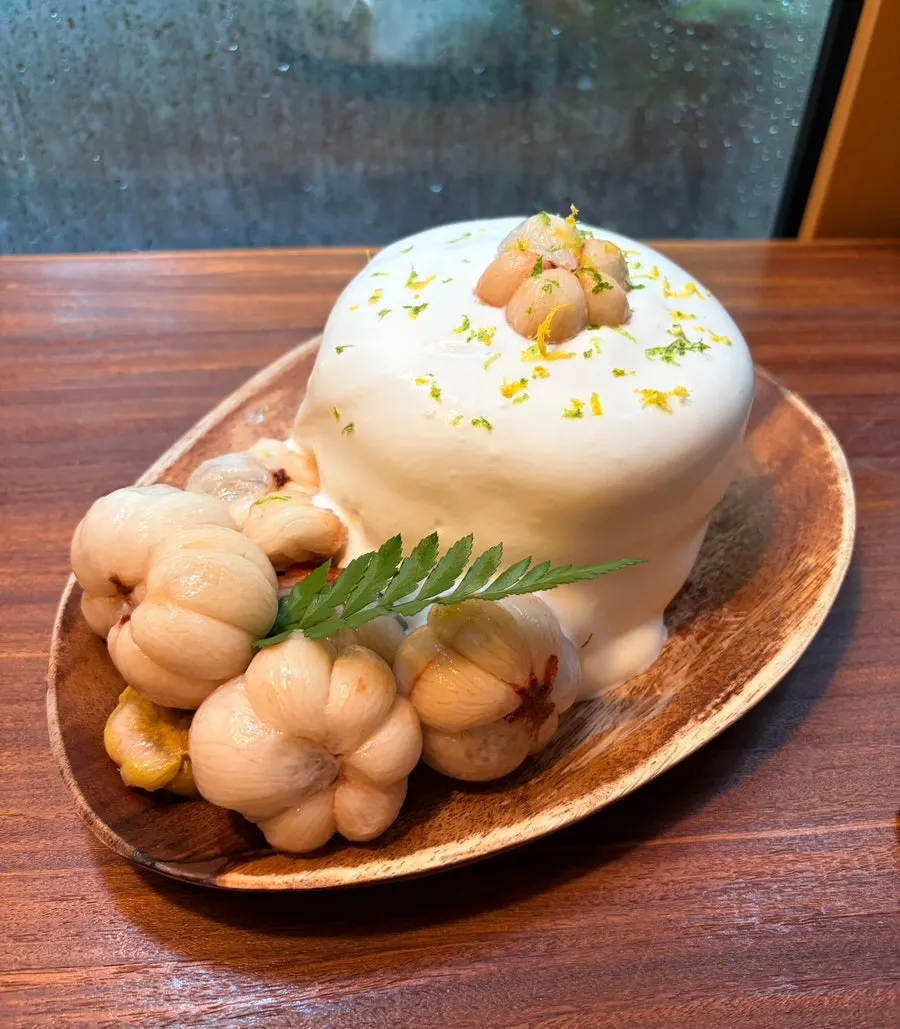 Mango steen and cream on top of the soufflé