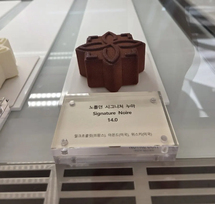 French-style handmade cake display case