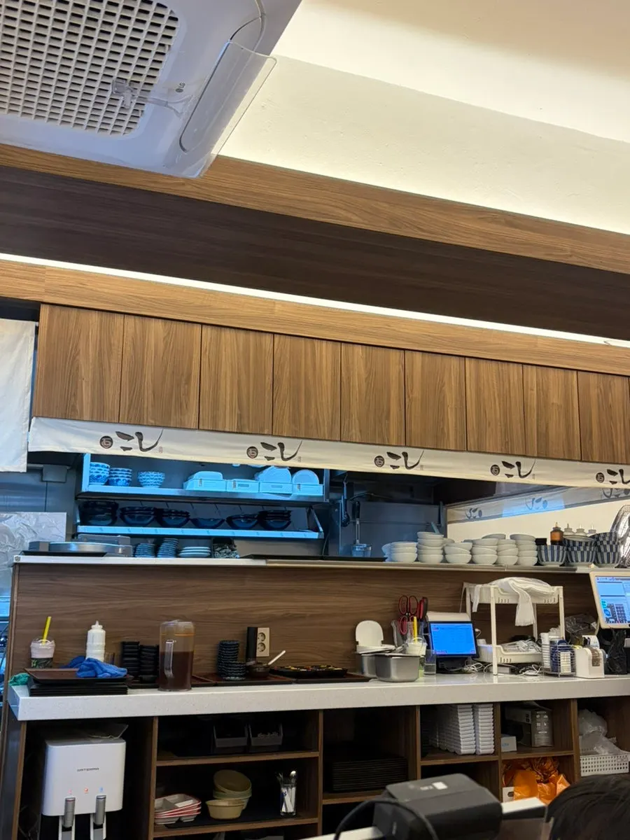 Interior of Kosi Seongsu Branch with open kitchen and bar seating