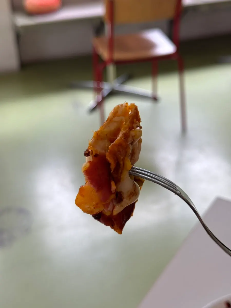 Pizza taiyaki split open to show the filling