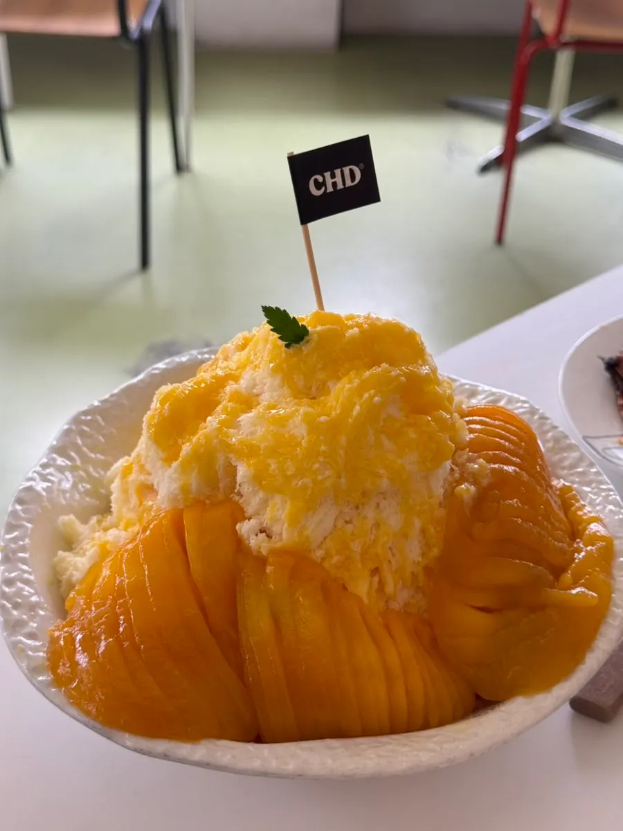 Childish mango bingsu piled high with fresh mango