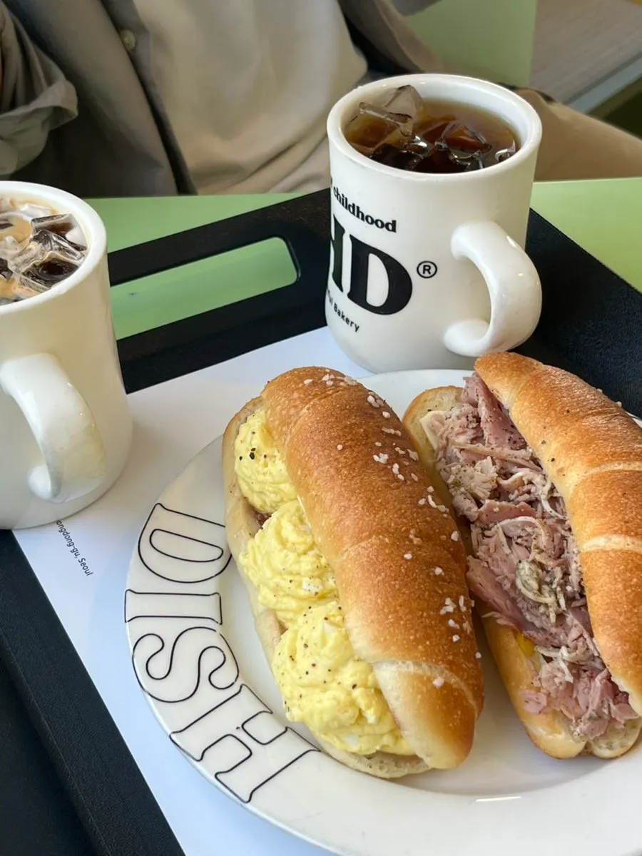 Two types of salted bread sandwiches with Americanos