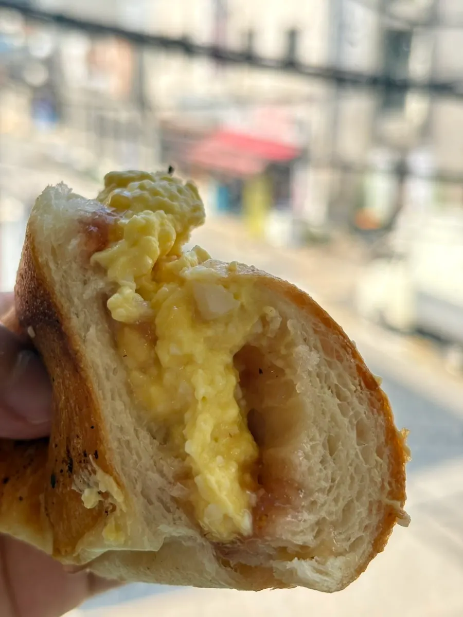 Salted bread cut in half with a knife