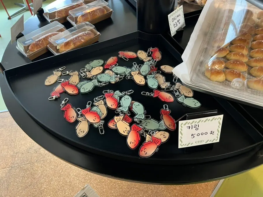 Keyring goods next to the bread display corner at Childish