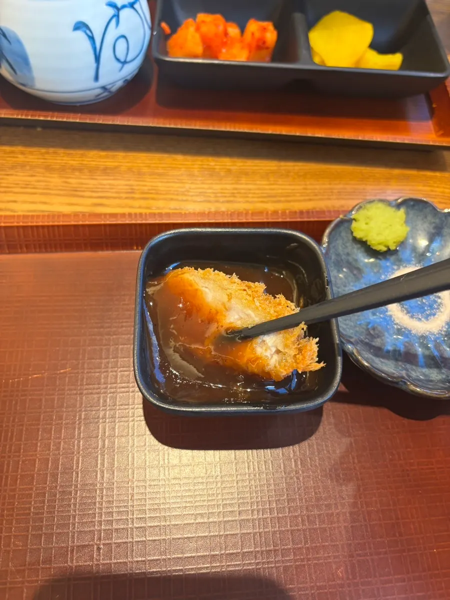 Cross-section of cheese tonkatsu with cheese oozing out