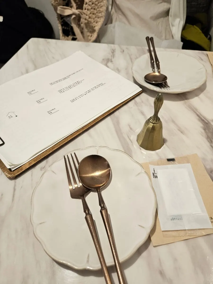 The table we were seated at, with the service call bell