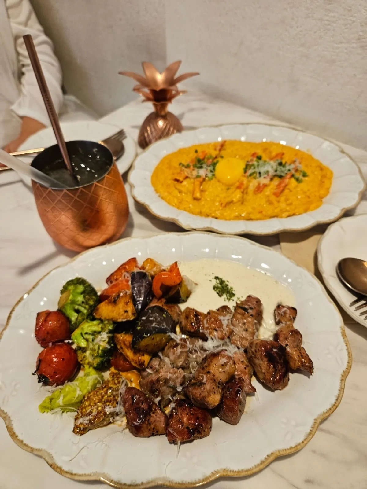 Table spread of steak and spicy crab risotto at Seongsu Darak