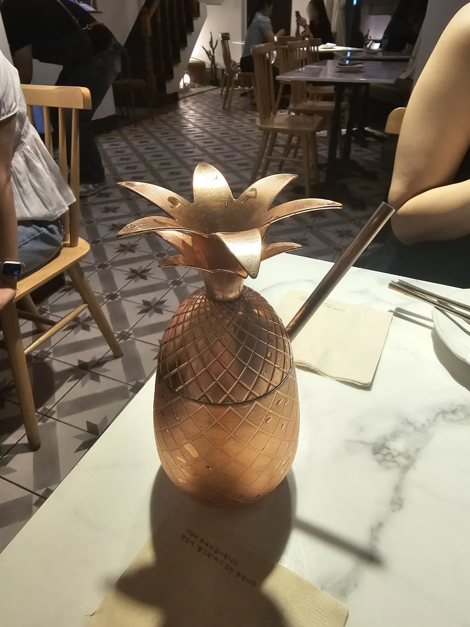 Darak Ade in a pineapple-shaped glass