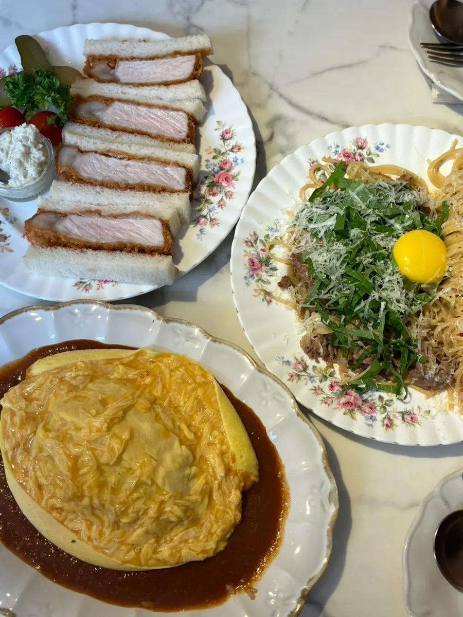 Ordered dishes filling a table for two